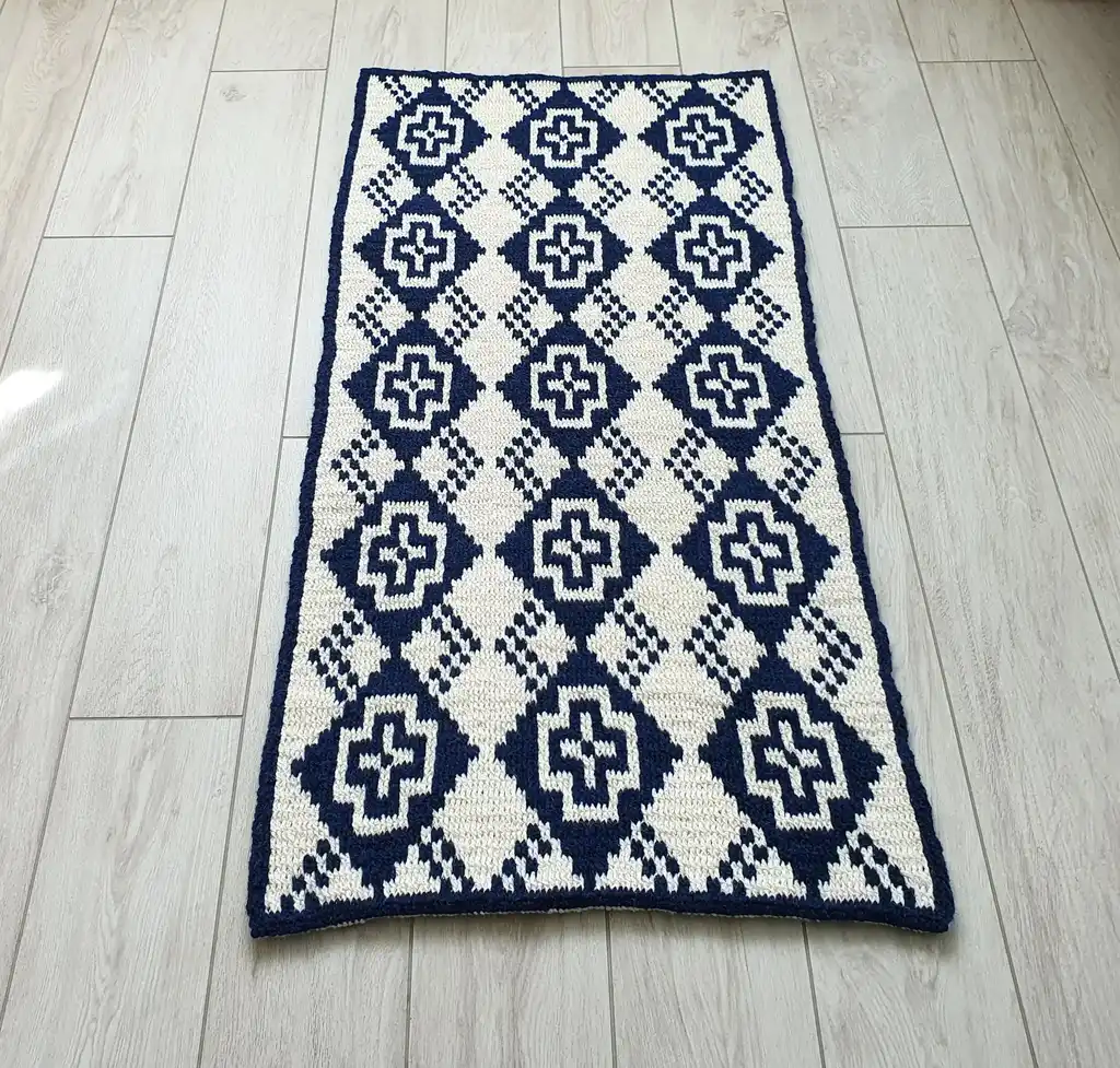 Crochet wool rug in natural colors, perfect for home decor.