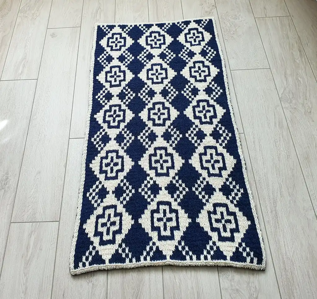 Crochet wool rug in natural colors, perfect for home decor.
