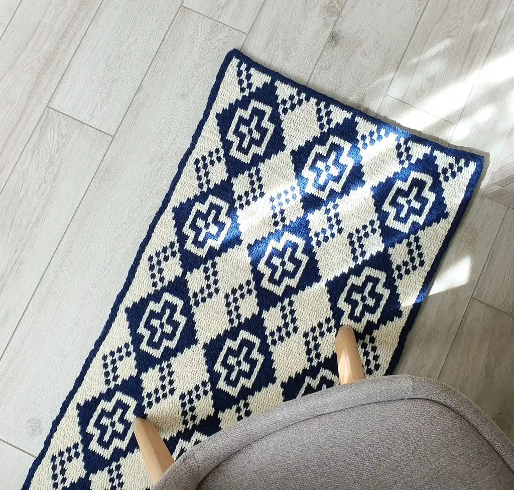 Crochet wool rug in natural colors, perfect for home decor.