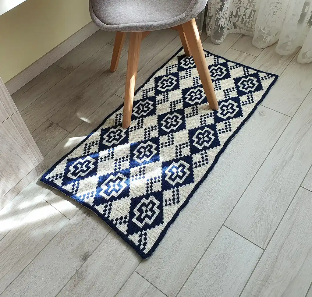 Crochet wool rug in natural colors, perfect for home decor.