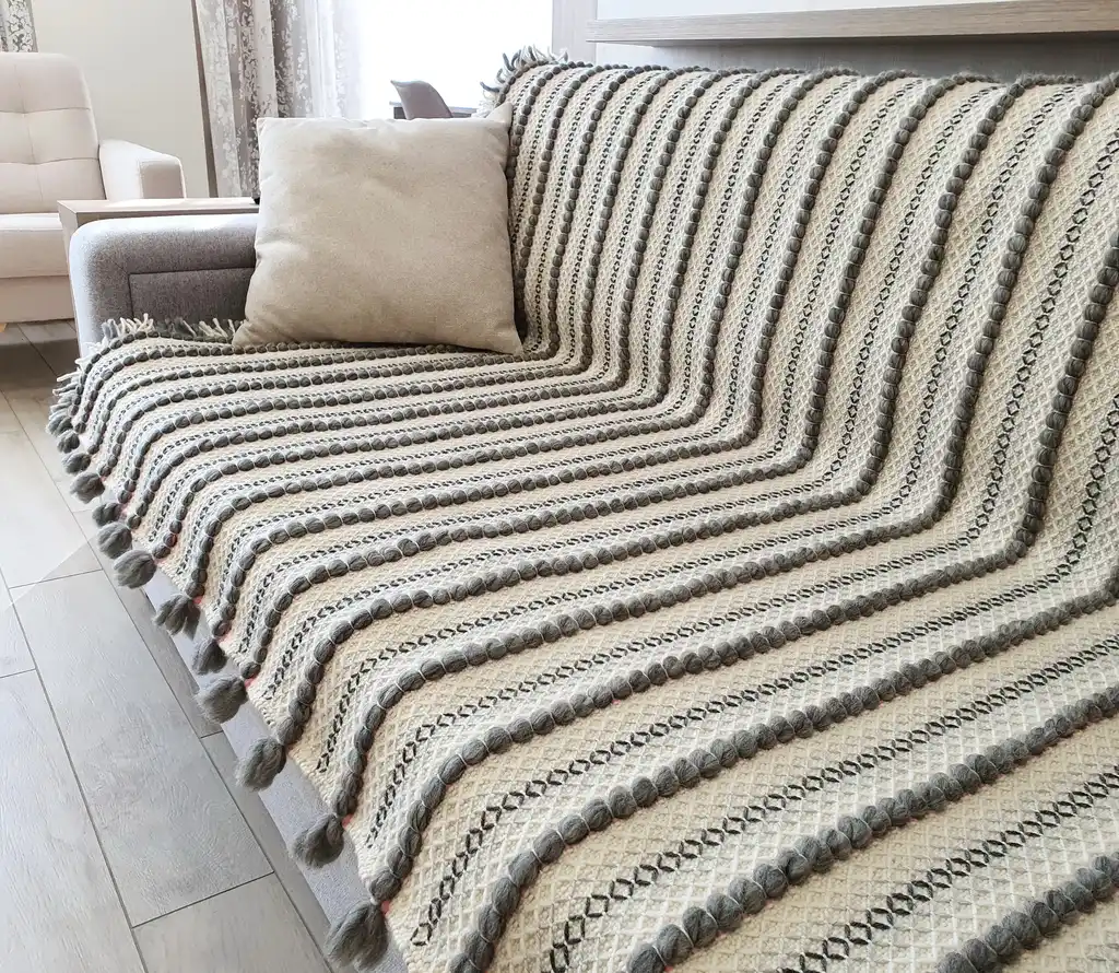 handwoven chunky wool throw blanket in natural color, showcasing traditional weaving texture and premium quality materials.
