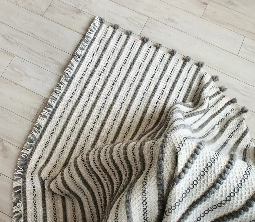 handwoven chunky wool throw blanket in natural color, showcasing traditional weaving texture and premium quality materials.