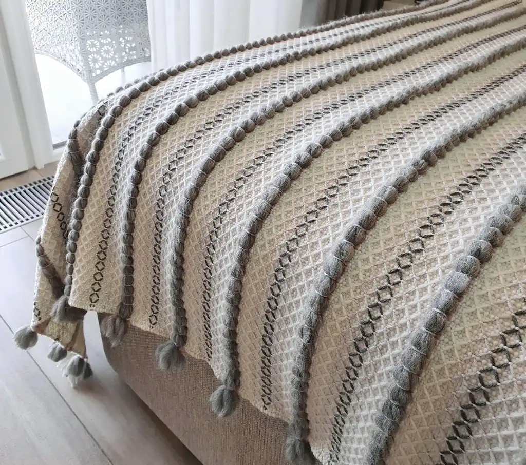 handwoven chunky wool throw blanket in natural color, showcasing traditional weaving texture and premium quality materials.