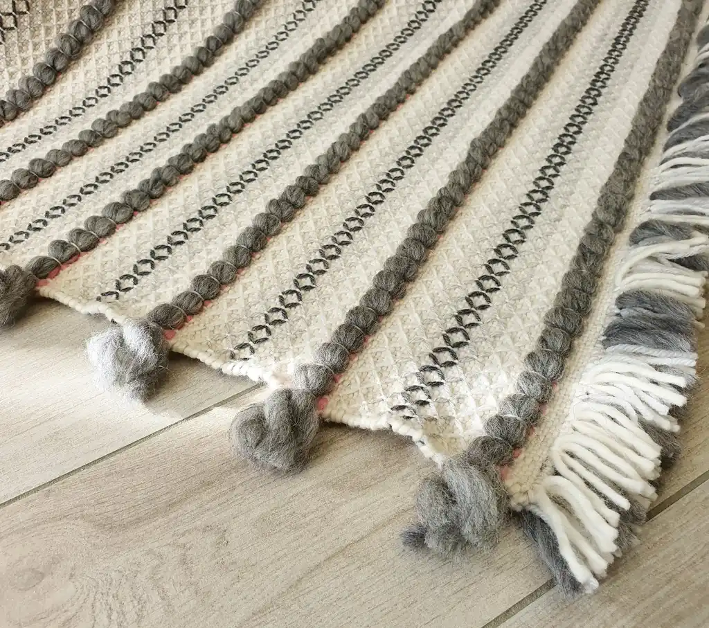 handwoven chunky wool throw blanket in natural color, showcasing traditional weaving texture and premium quality materials.
