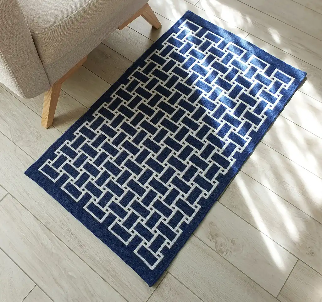 handwoven wool rug in natural colors showing detailed weaving texture and craftsmanship.