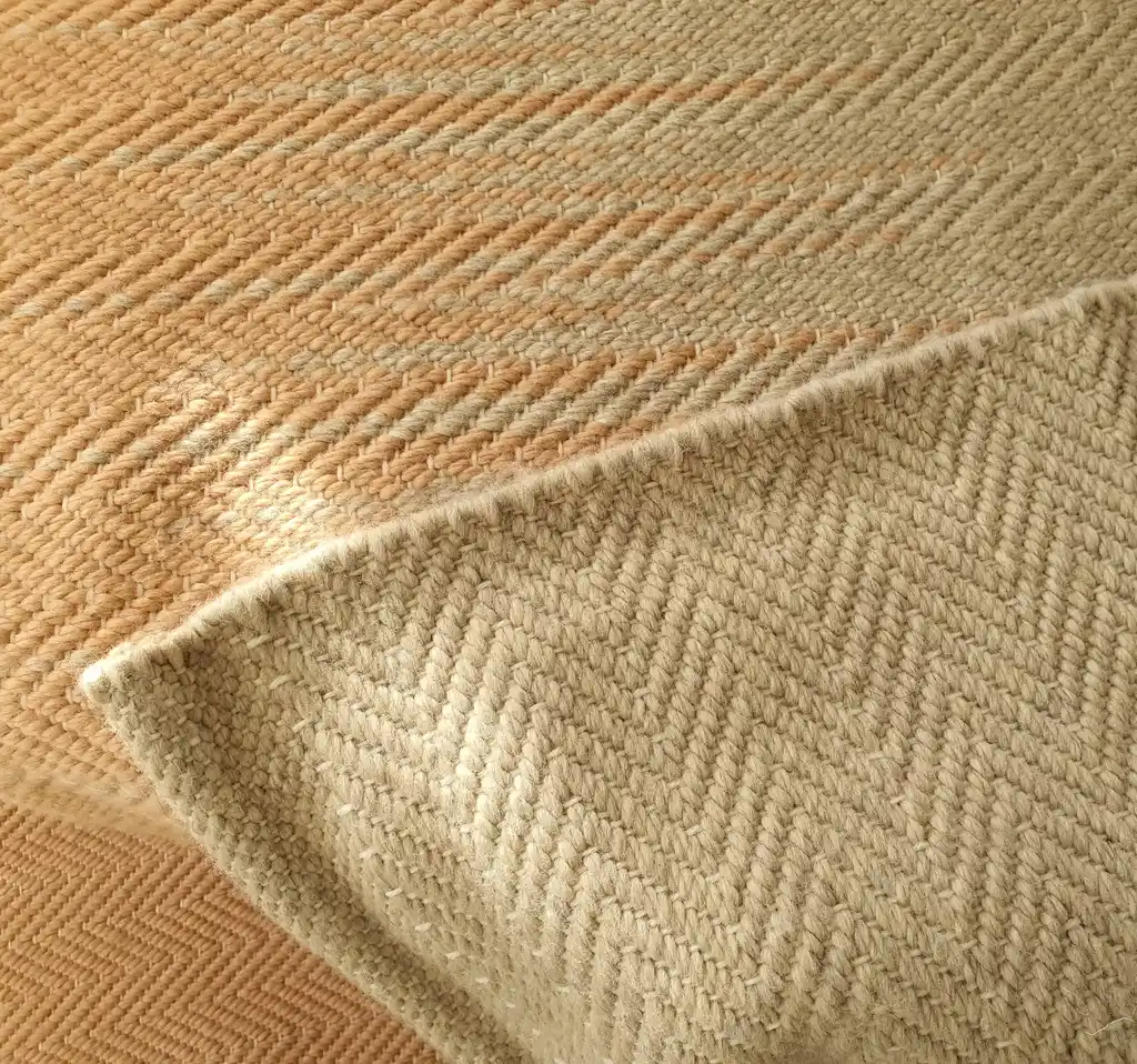 handwoven merino wool throw blanket in natural texture, luxury home textile.