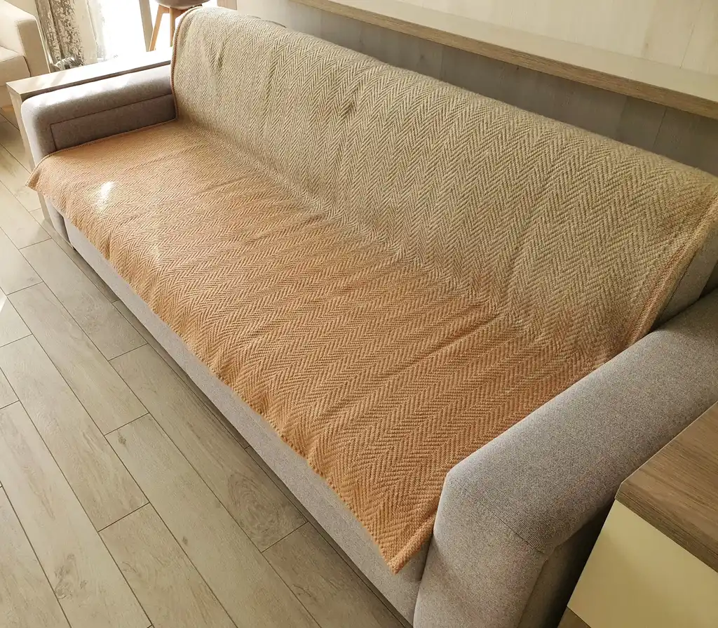 handwoven merino wool throw blanket in natural texture, luxury home textile.