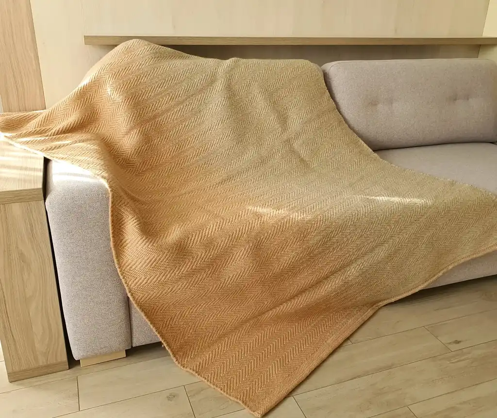 handwoven merino wool throw blanket in natural texture, luxury home textile.