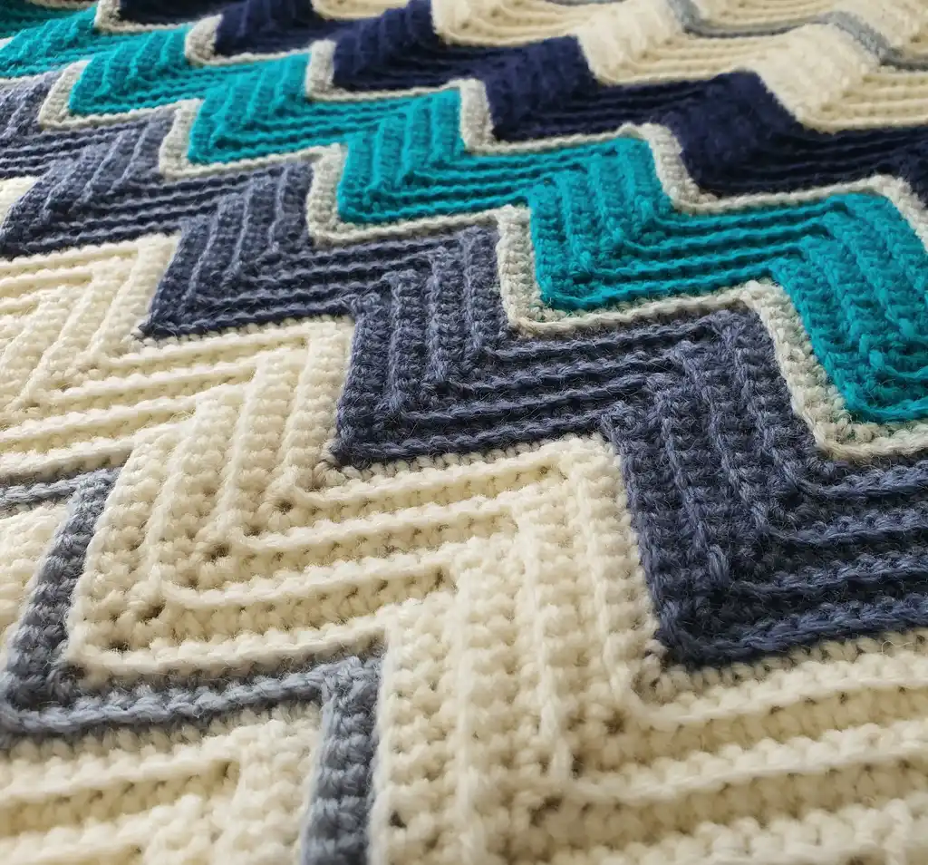 handmade Crochet throw blanket in blended wool, machine washable home textile.