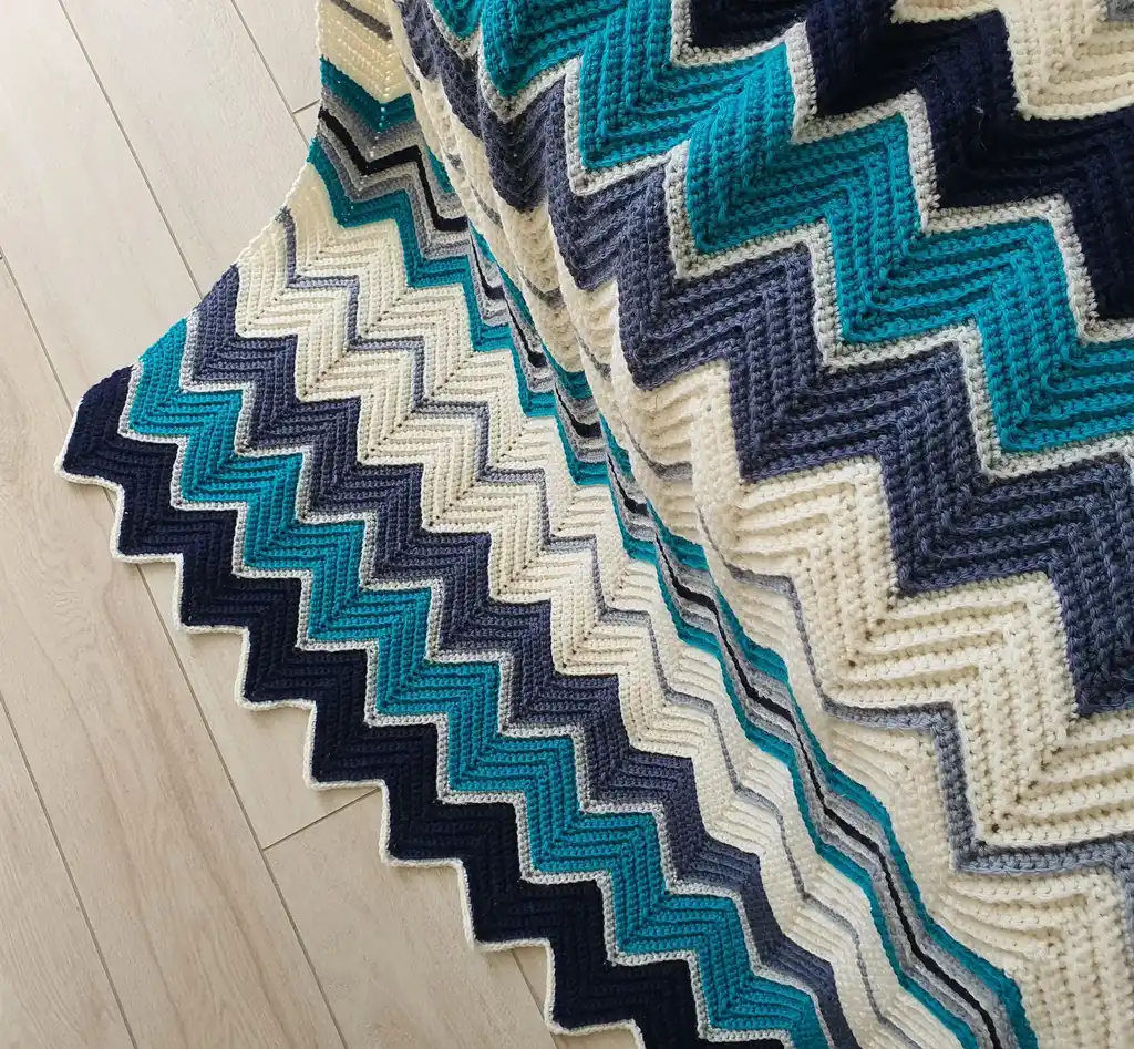 handmade Crochet throw blanket in blended wool, machine washable home textile.