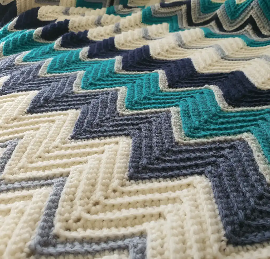 handmade Crochet throw blanket in blended wool, machine washable home textile.