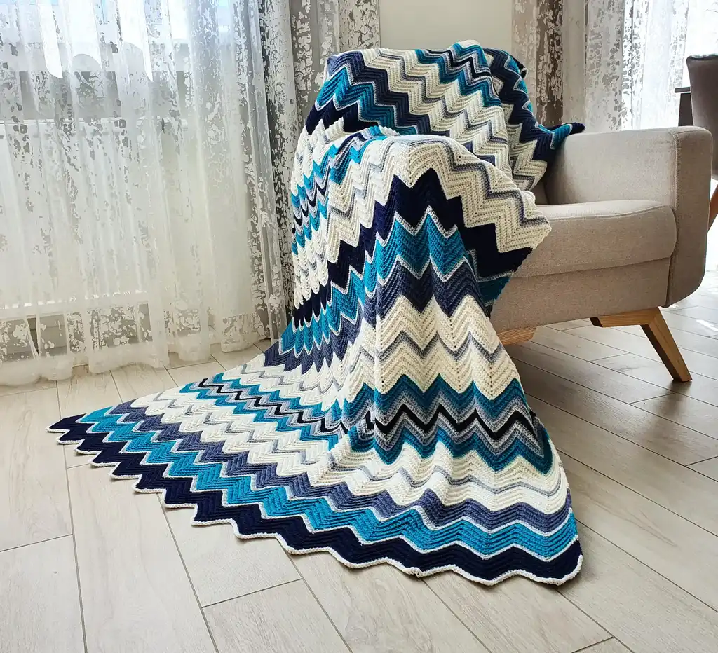handmade Crochet throw blanket in blended wool, machine washable home textile.