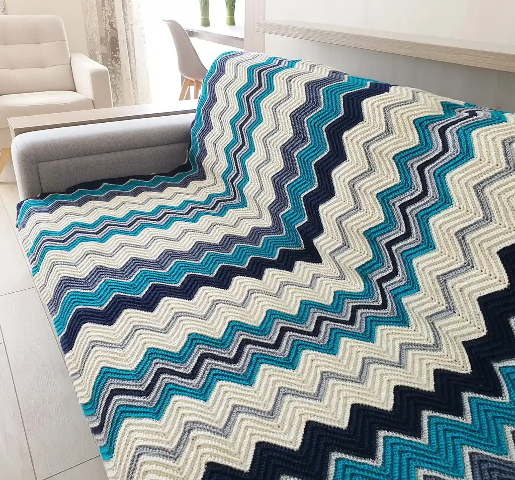 handmade Crochet throw blanket in blended wool, machine washable home textile.