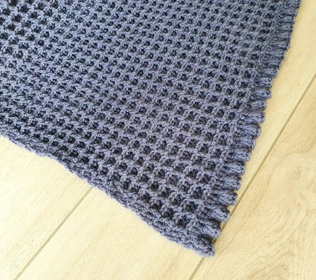 Crochet wool throw blanket in natural colors, machine washable.