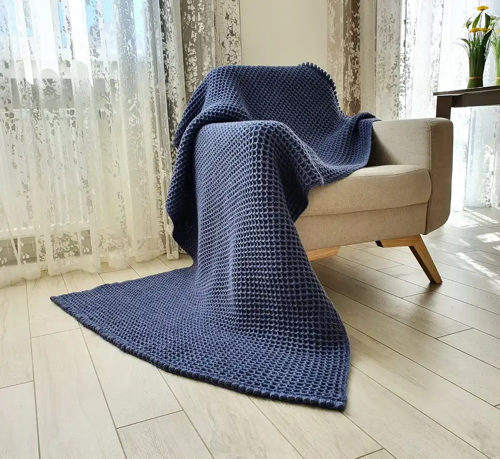Crochet wool throw blanket in natural colors, machine washable.