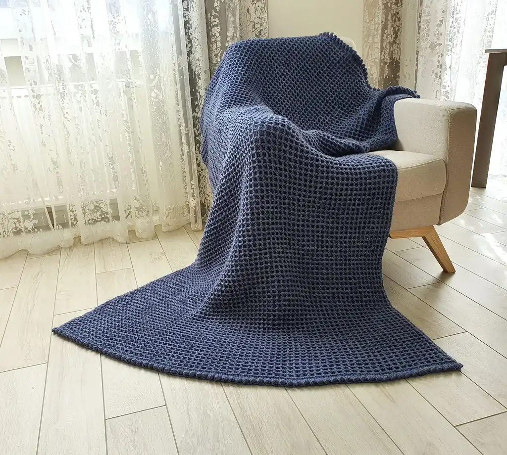 Crochet wool throw blanket in natural colors, machine washable.