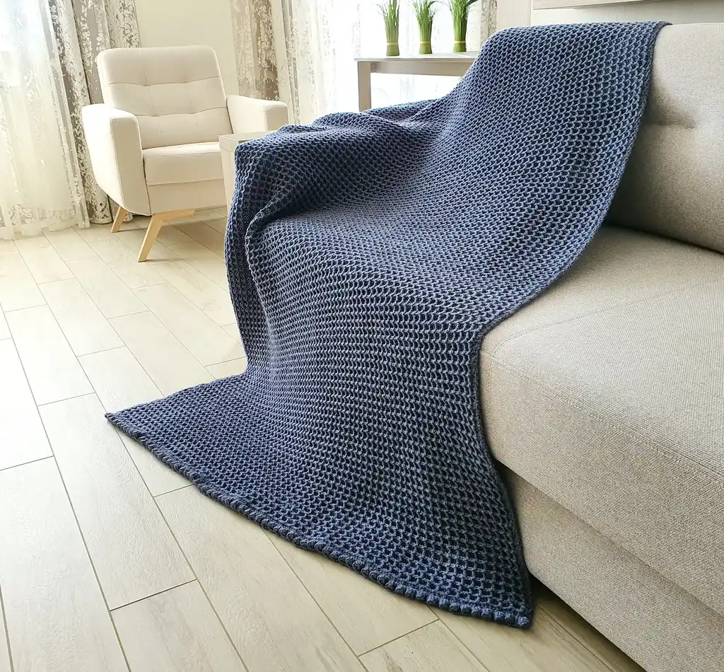 Crochet wool throw blanket in natural colors, machine washable.