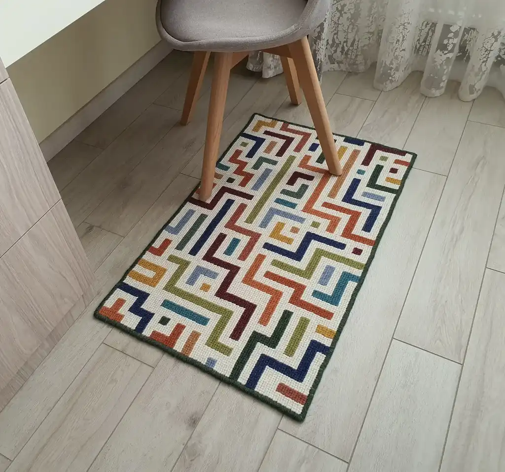 handcrafted embroidered wool rug with intricate traditional patterns.