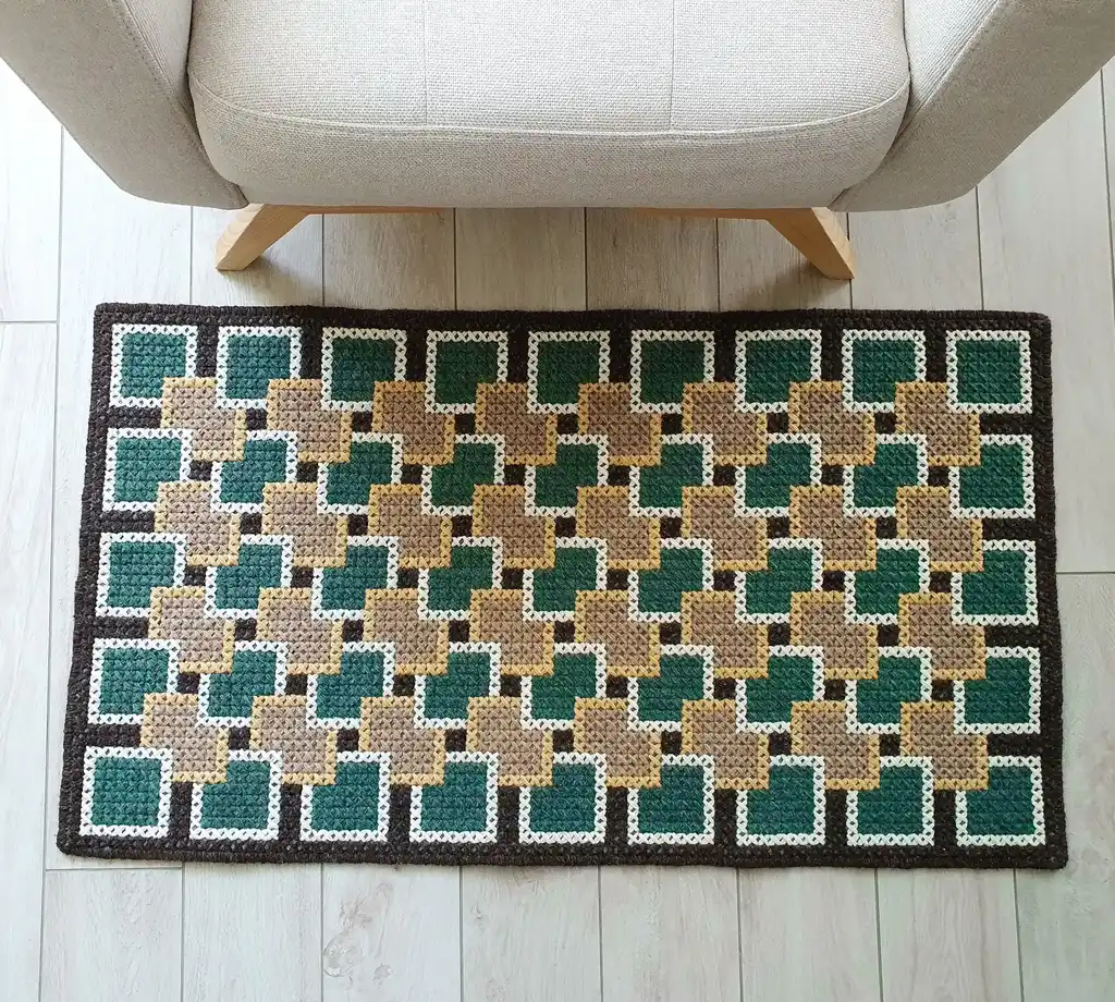 handmade cross-stitch rug made from wool and artificial felt, decorative floor covering.