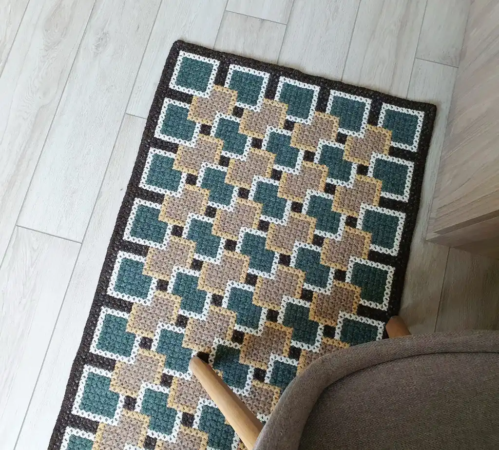 handmade cross-stitch rug made from wool and artificial felt, decorative floor covering.