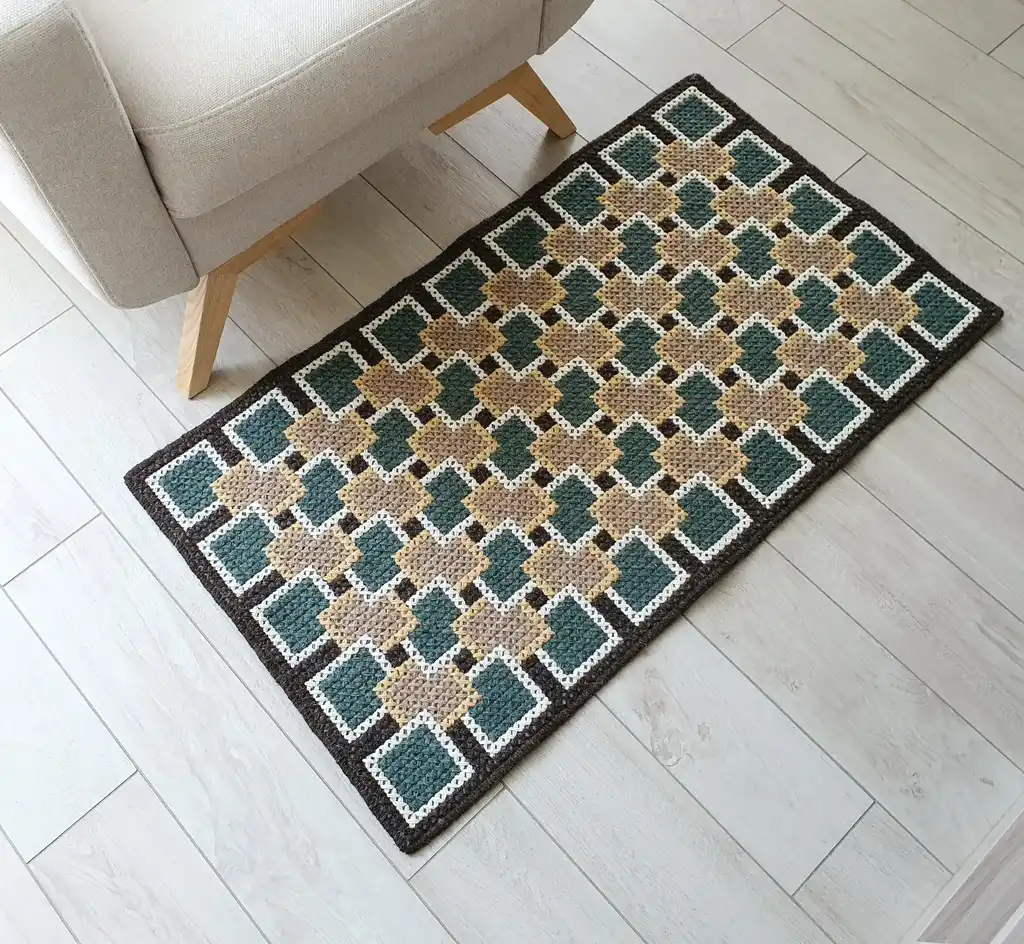 handmade cross-stitch rug made from wool and artificial felt, decorative floor covering.