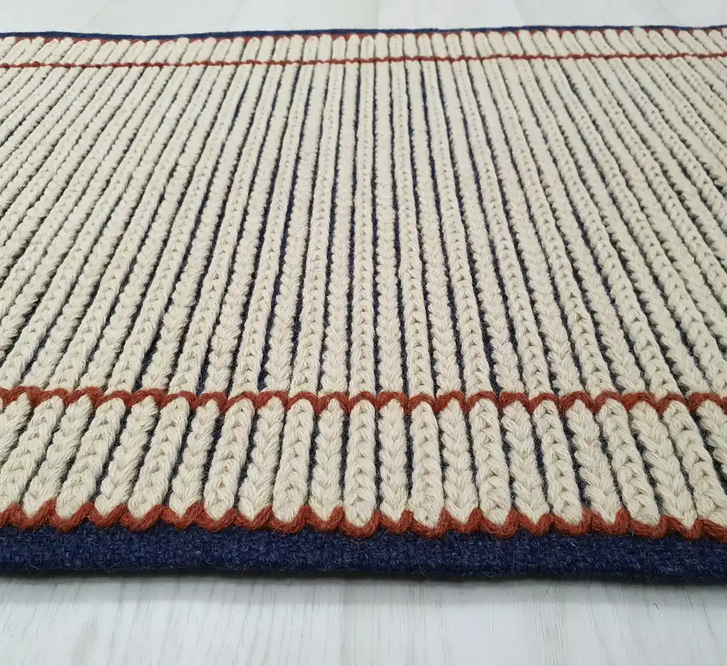 handwoven wool rug with traditional Ukrainian weaving pattern.