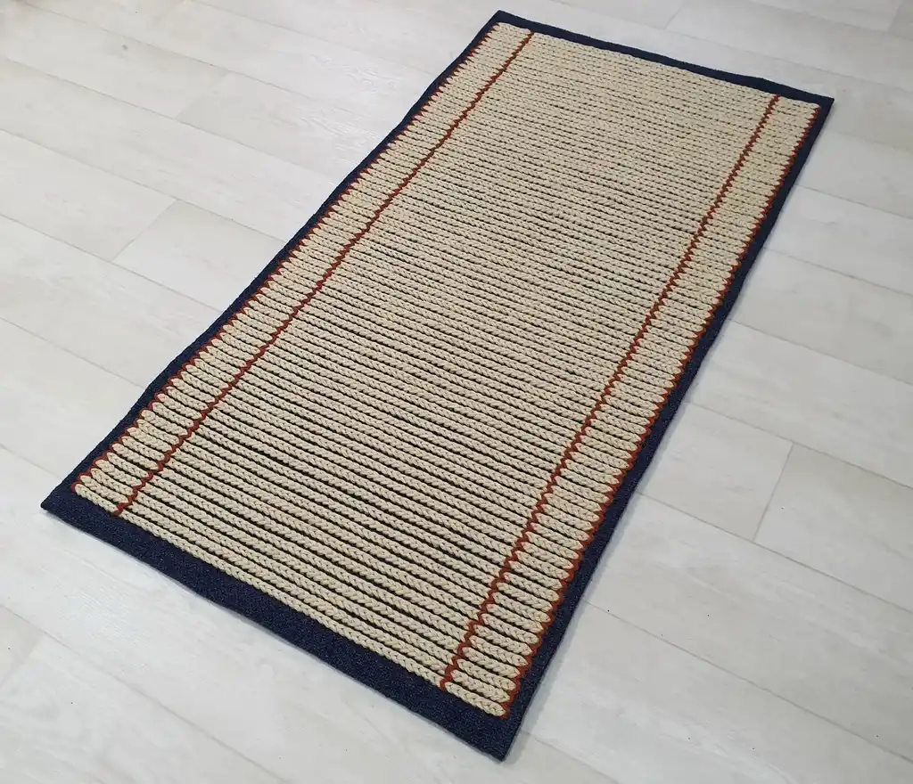 handwoven wool rug with traditional Ukrainian weaving pattern.