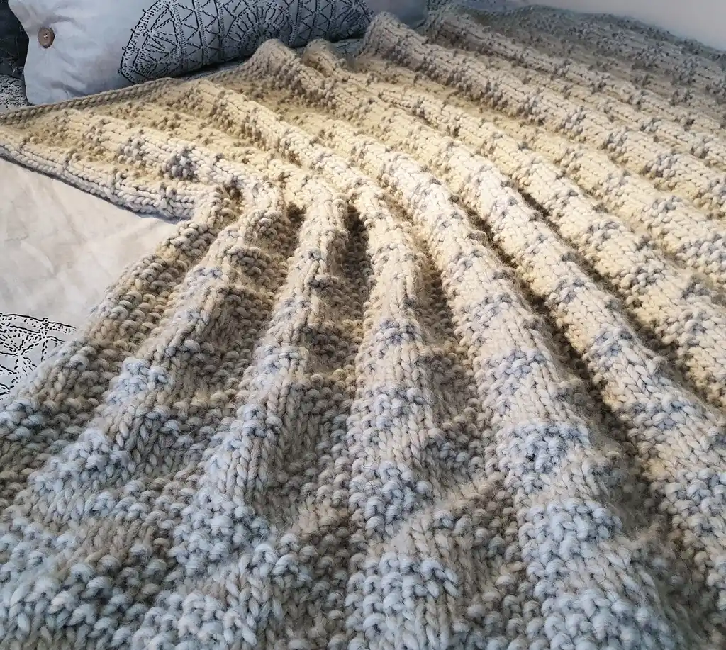 luxury merino wool knitted throw blanket for home decor.