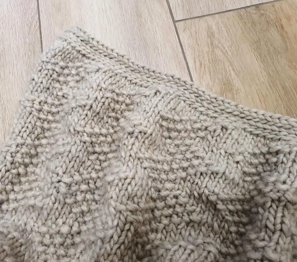 luxury merino wool knitted throw blanket for home decor.