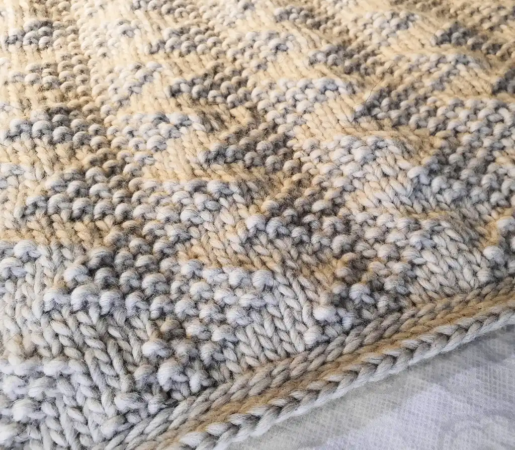 luxury merino wool knitted throw blanket for home decor.