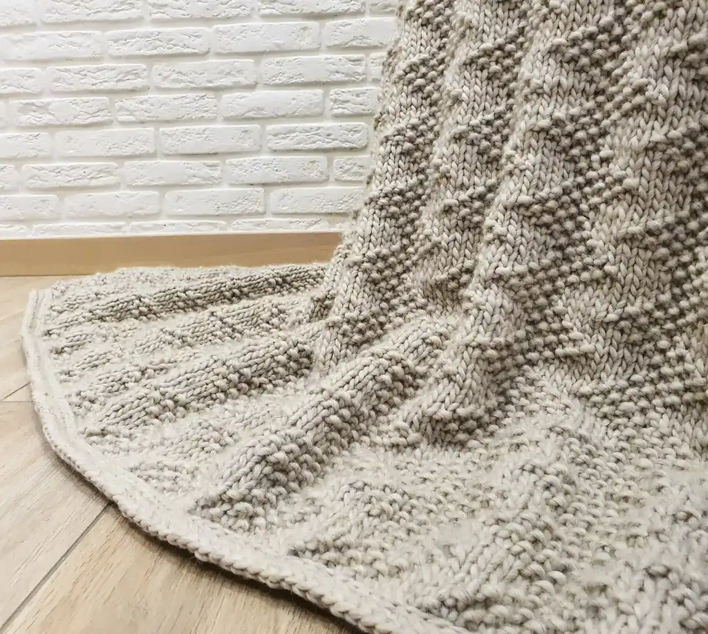 luxury merino wool knitted throw blanket for home decor.