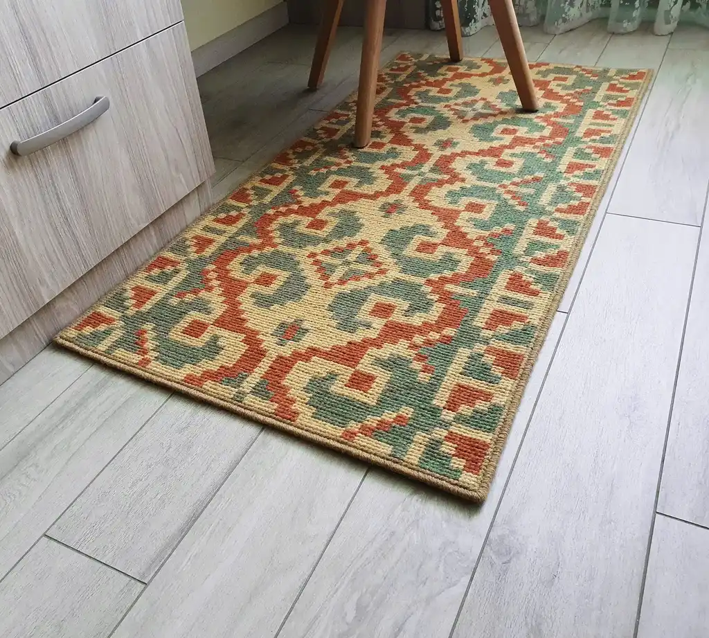 handcrafted wool rug with traditional embroidery pattern.