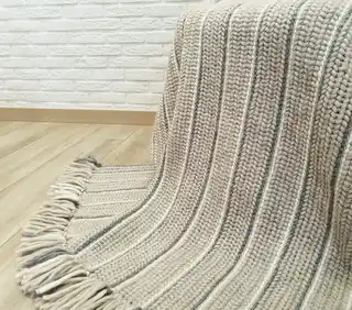 luxury crochet throw blanket made from merino wool.