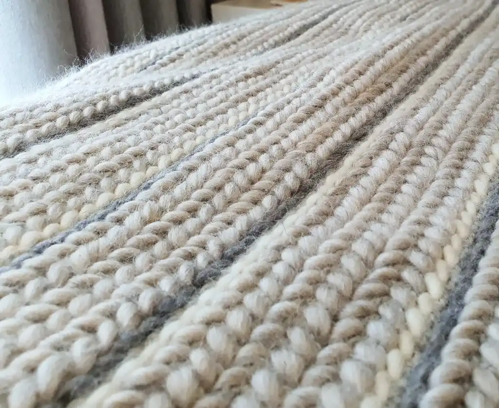 luxury crochet throw blanket made from merino wool.