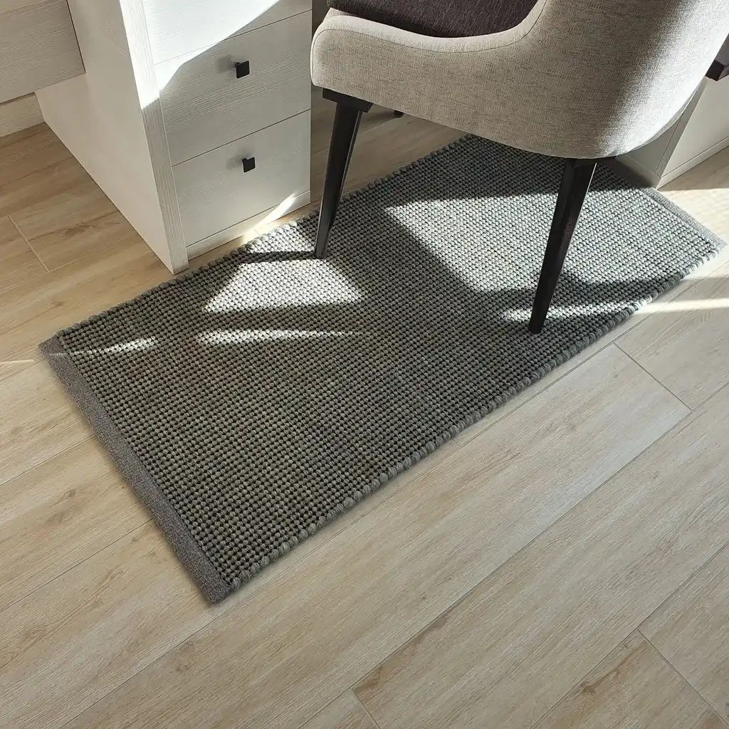 handwoven chunky wool rug with traditional weaving pattern.