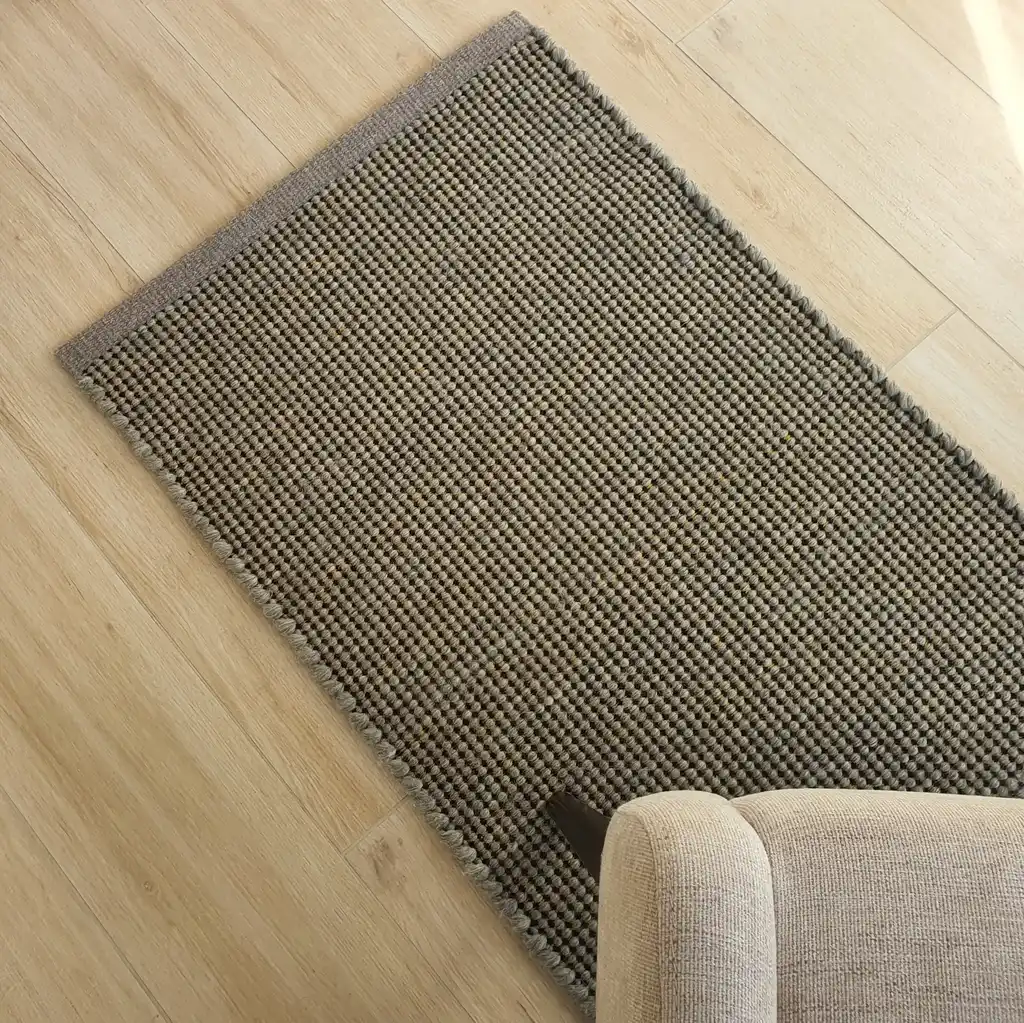 handwoven chunky wool rug with traditional weaving pattern.