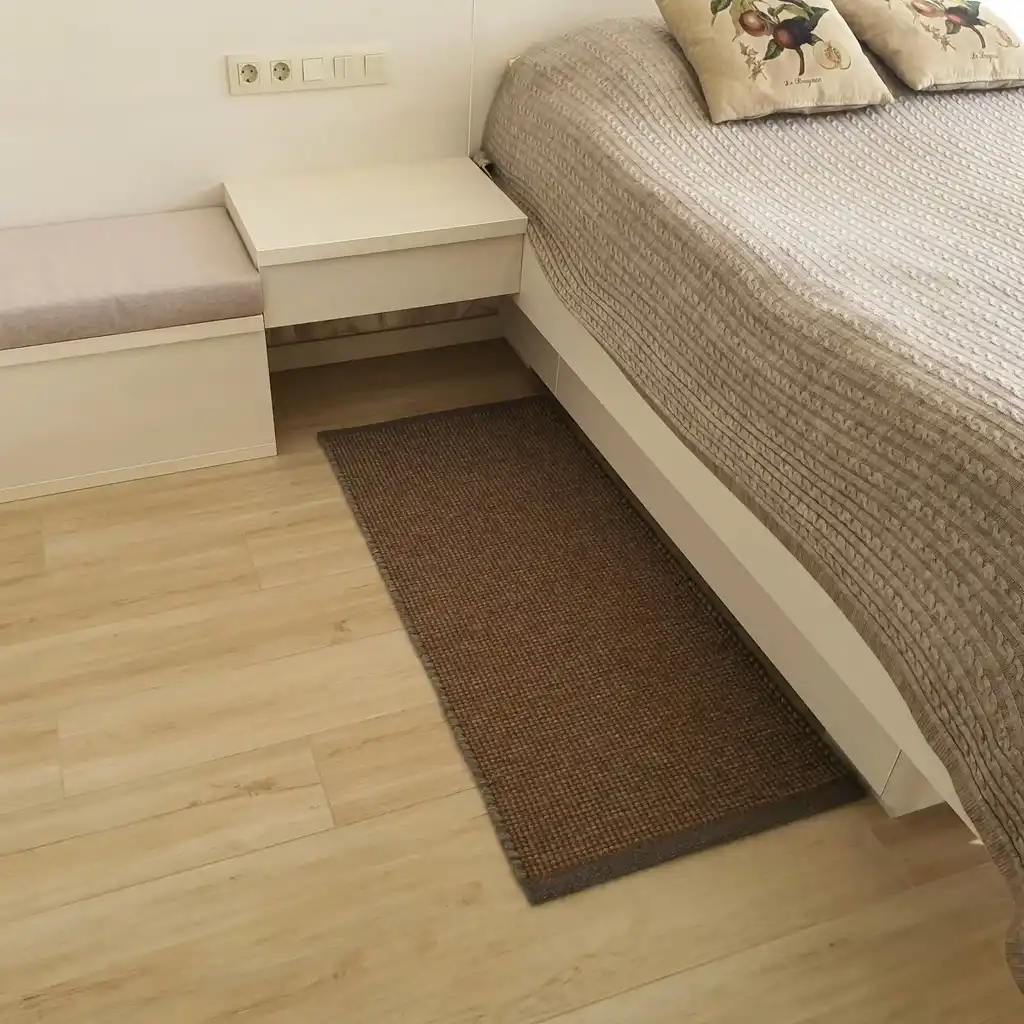 handwoven chunky wool rug in natural colors, traditional weaving technique.