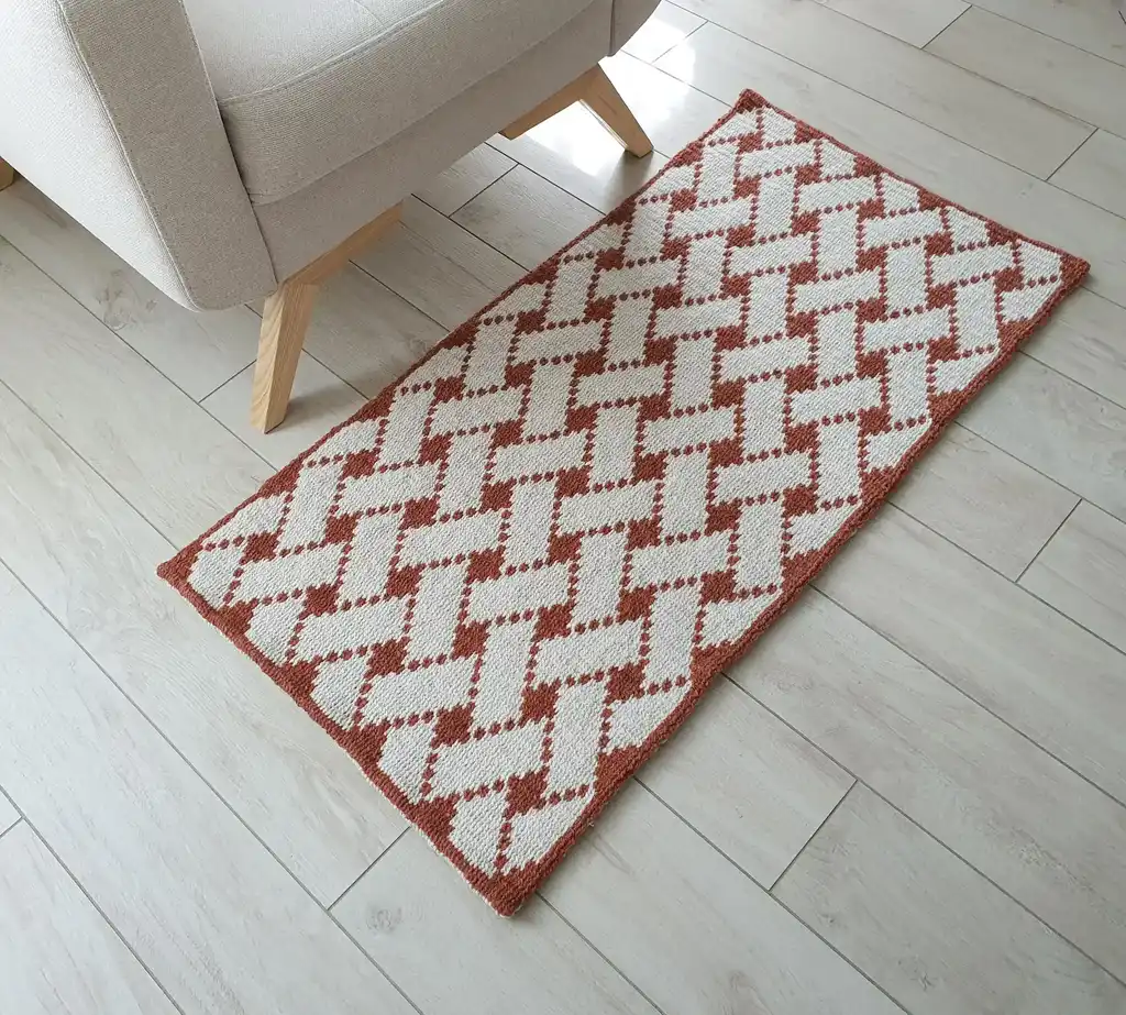 Handcrafted wool crochet rug with traditional Ukrainian Easter egg patterns in vibrant colors.