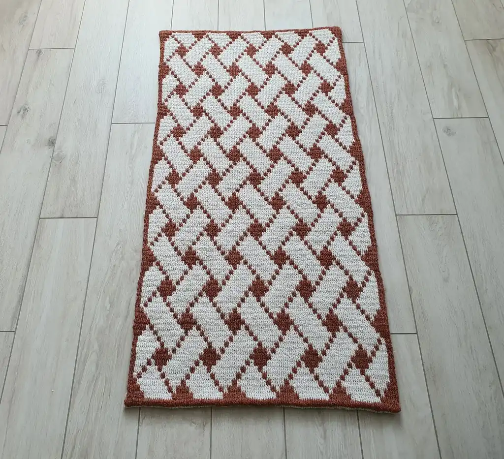 Handcrafted wool crochet rug with traditional Ukrainian Easter egg patterns in vibrant colors.