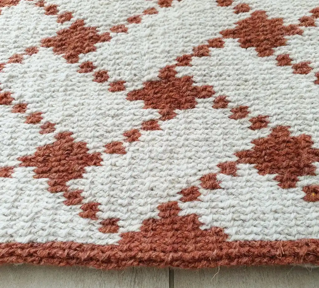 Handcrafted wool crochet rug with traditional Ukrainian Easter egg patterns in vibrant colors.