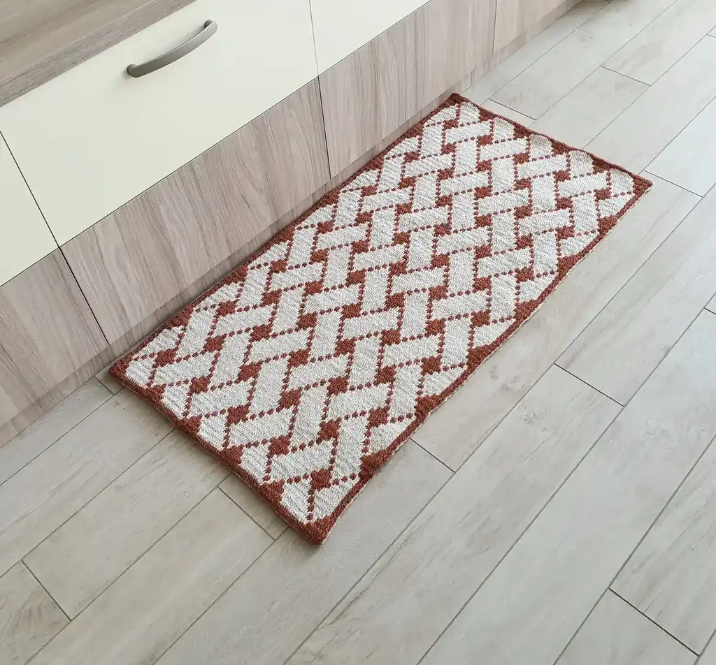 Handcrafted wool crochet rug with traditional Ukrainian Easter egg patterns in vibrant colors.