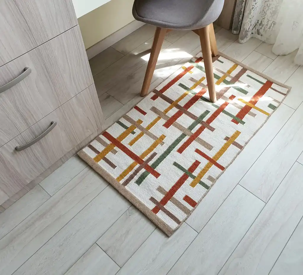 handwoven wool rug with traditional Ukrainian patterns in natural colors.