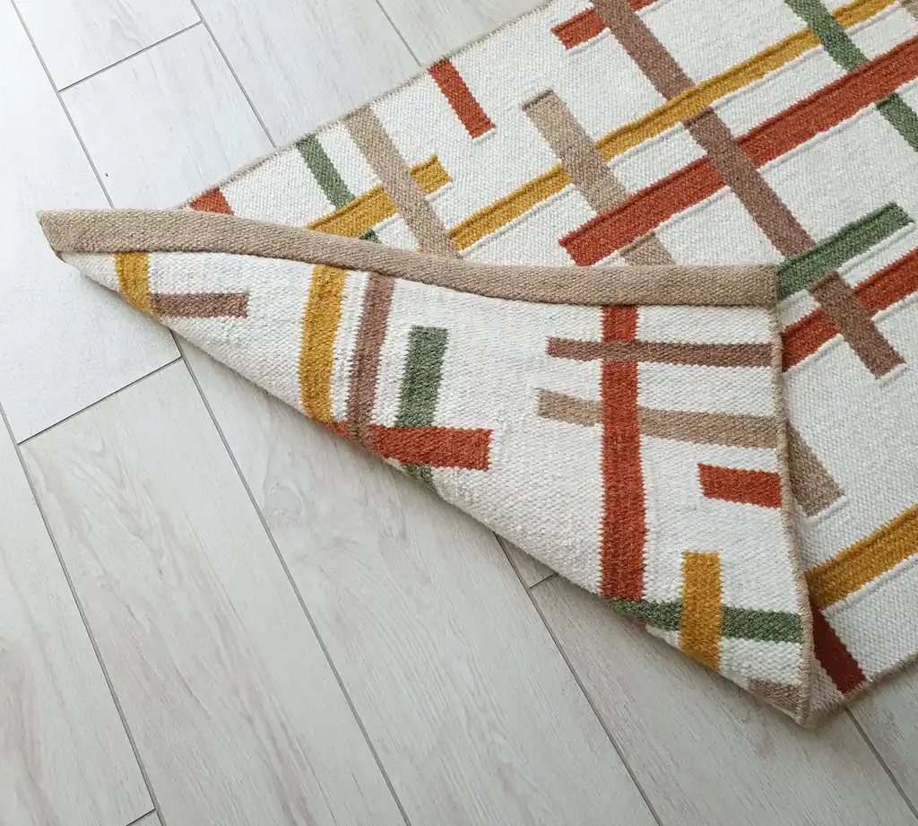 handwoven wool rug with traditional Ukrainian patterns in natural colors.