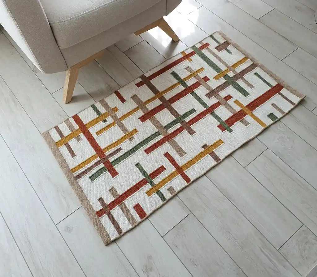 handwoven wool rug with traditional Ukrainian patterns in natural colors.