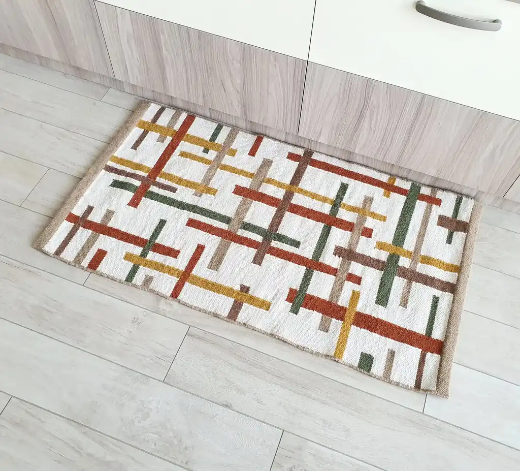 handwoven wool rug with traditional Ukrainian patterns in natural colors.