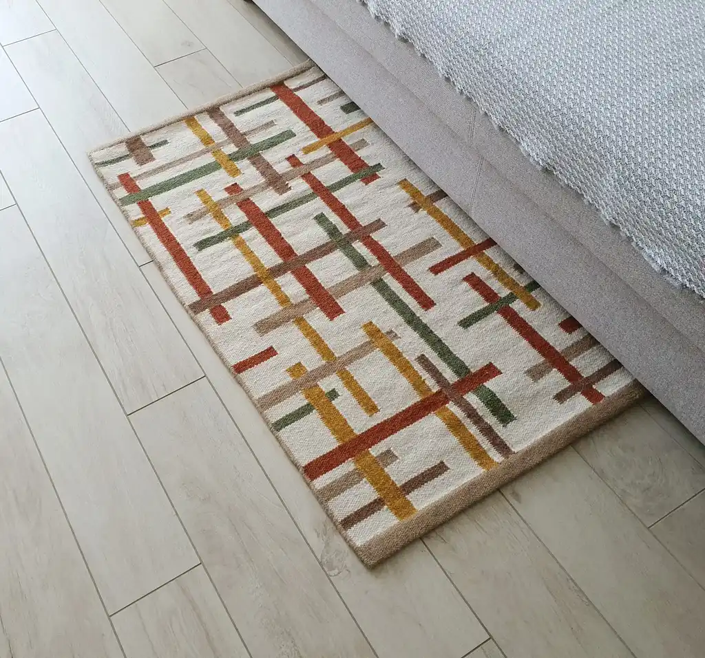 handwoven wool rug with traditional Ukrainian patterns in natural colors.