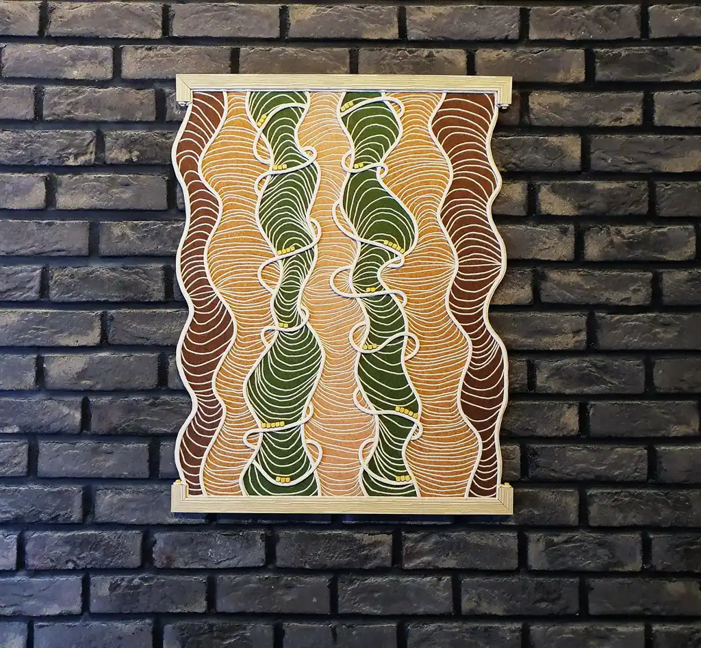 handmade embroidered wall hanging made from felt with rope and beech wood accents.