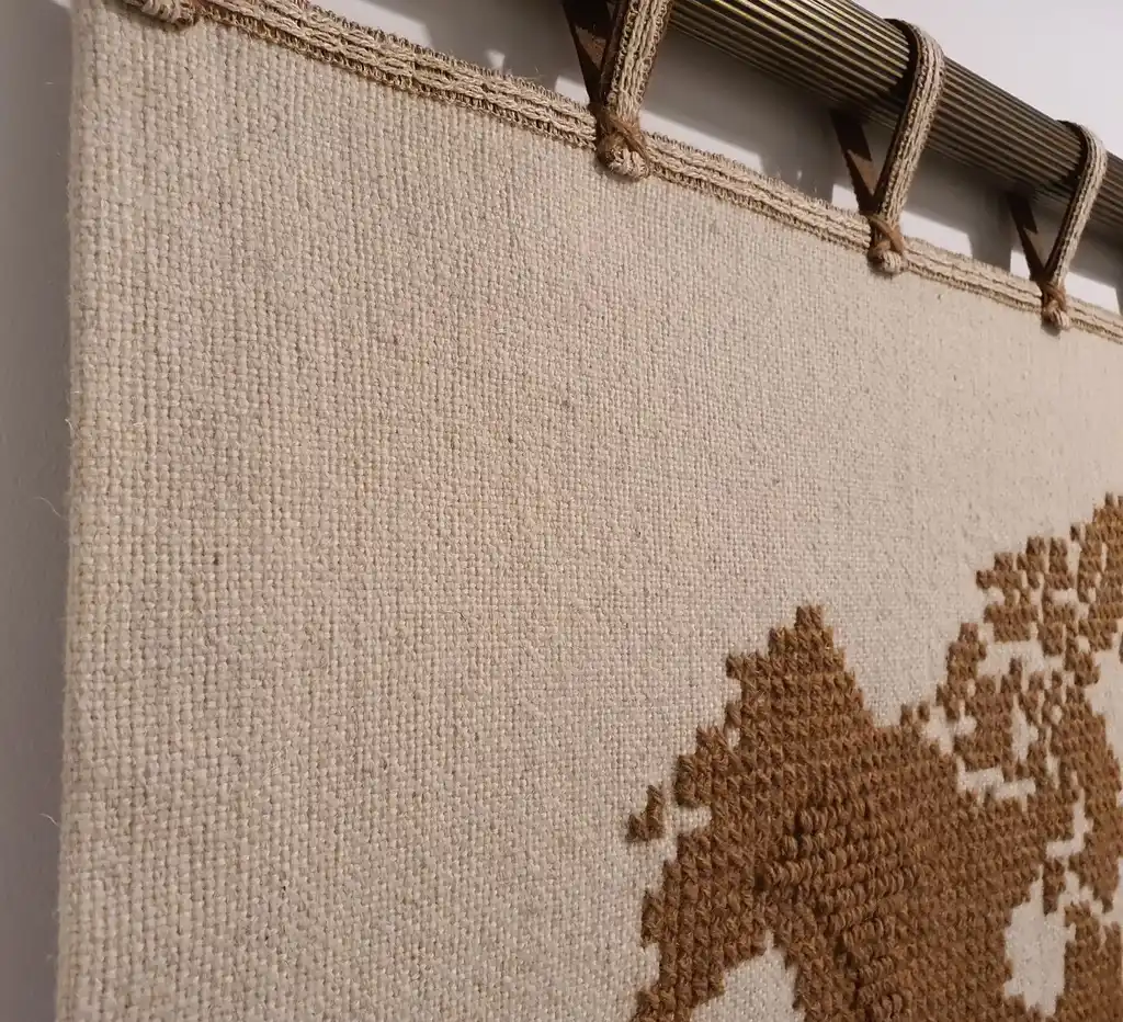 handwoven wool wall hanging with traditional weaving patterns.