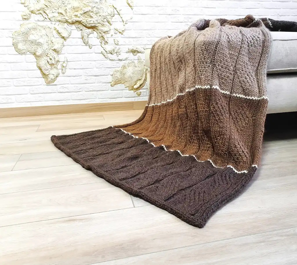 luxury knitted merino wool throw blanket in beige color.