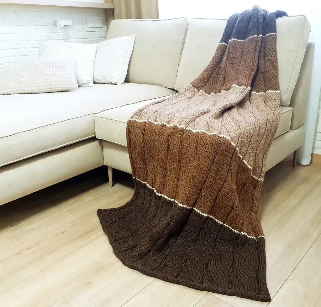 luxury knitted merino wool throw blanket in beige color.